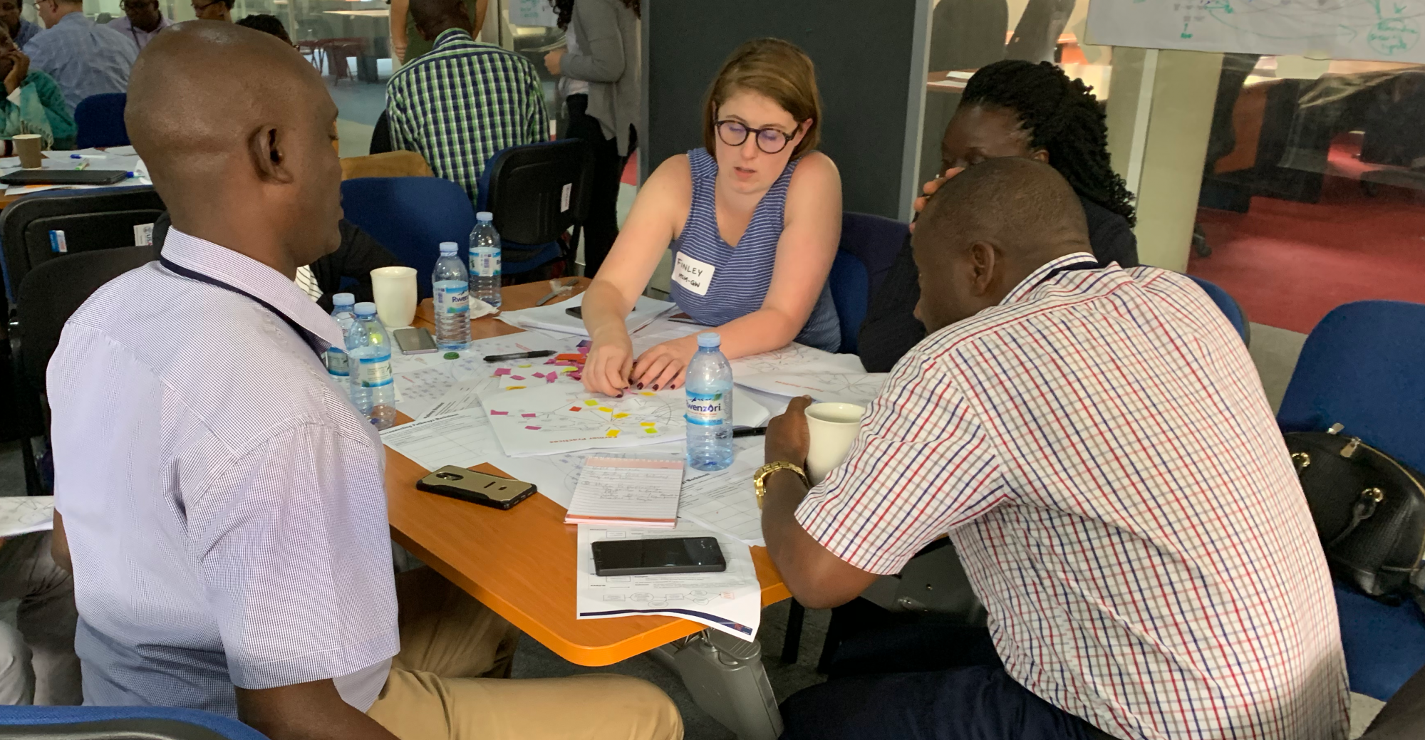 EMSE student Finley Wetmore working with stakeholders in Uganda